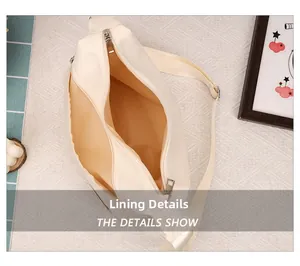 Detail view showing the spacious interior lining and secure zipper of the beige dumpling bag