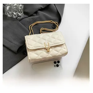 Detailed comparison of beige quilted crossbody bag size next to a modern smartphone