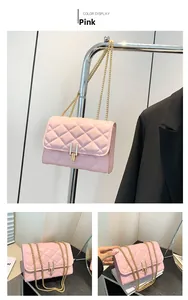 Detail of pink quilted chain bag with elegant gold metal lock and diamond stitch texture