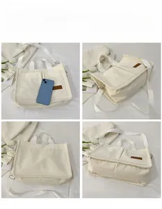 Detail view of large corduroy tote bag showing pockets and spacious interior for a phone