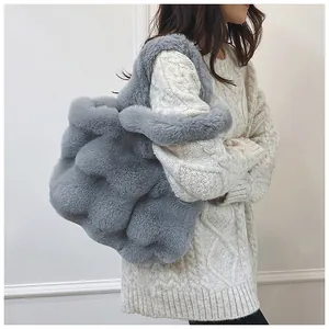 Detail of grey fluffy faux fur tote bag showing the thick plush texture and large capacity