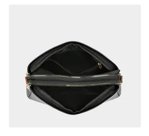 Top view of black shell bag showing interior dual compartments and zipper pockets