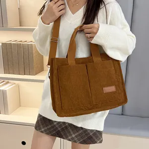 Brown corduroy tote bag with large capacity, dual pockets and adjustable strap for women