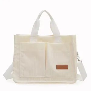 Cream corduroy large tote bag with adjustable shoulder strap and double front pockets