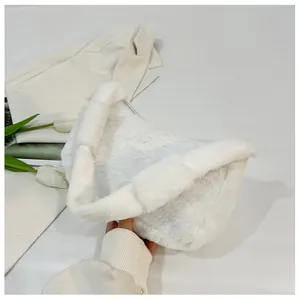 Detail of white faux fur handbag showing plush texture and smooth zipper closure