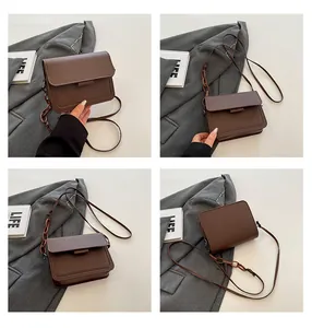 Multi-angle views of a brown PU leather crossbody bag with a large acrylic chain detail
