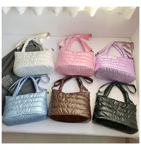 Quilted puffer bags collection in six colors with glossy water-resistant finish and straps