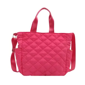 Hot pink quilted tote bag with adjustable shoulder strap and double handles for daily use