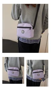Detailed views of light purple nylon crossbody bag with Sport logo and adjustable strap