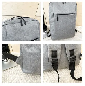 Detailed close-up showing reinforced stitching and adjustable buckles on a grey business backpack
