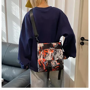 Graffiti nylon crossbody bag shown on a model for actual size and casual fit reference