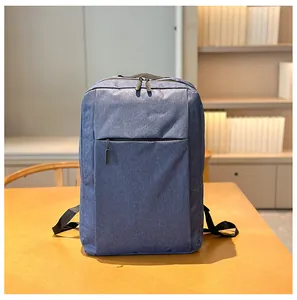 Detail view of grey-blue business laptop backpack with fabric texture and zippers