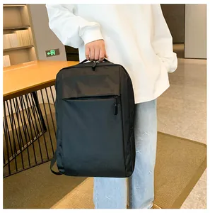 Side view of black business backpack with matte fabric and durable top handle