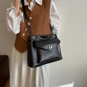 Black glossy faux leather crossbody hobo bag with silver chain strap for women