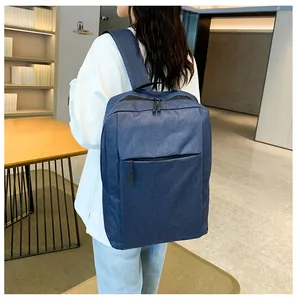 Detailed view of deep blue water-resistant oxford fabric on a minimalist business backpack