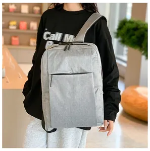 Detailed view of gray oxford fabric business backpack with front zipper compartment
