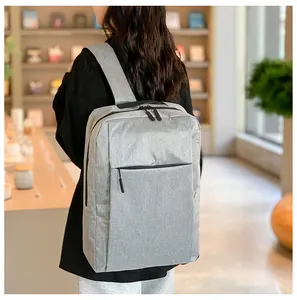 Detailed texture of gray polyester business laptop backpack with durable zippers