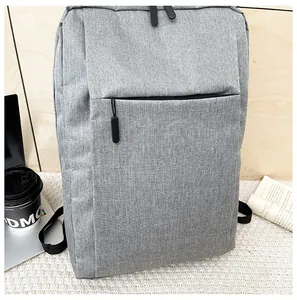 Close-up of a grey business laptop backpack with durable fabric and front zipper detail