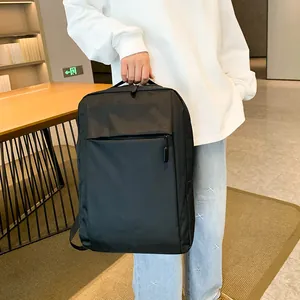 Minimalist black laptop backpack with large capacity and hidden front zipper pocket