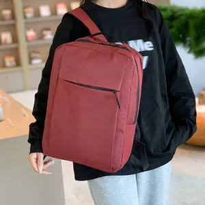 Business laptop backpack in dark red canvas with large capacity for travel and commute