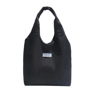 Large black corduroy tote bag for women with minimalist Fashion Instinct woven label