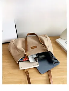 Spacious corduroy tote bag showing interior storage for tablets and books