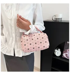 Detail of floral corduroy pouch showing delicate print and soft texture for storage