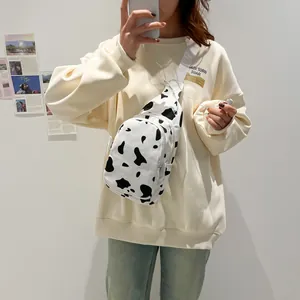 Fashionable cow print canvas chest bag with adjustable strap and dual zipper pockets