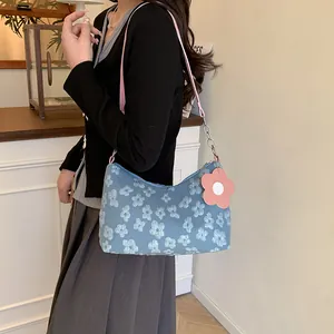 Floral canvas tote bag with light blue jacquard patterns and pink flower pendant charm