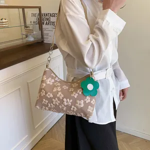Brown floral embroidery canvas shoulder bag with chain strap and flower charm accessory