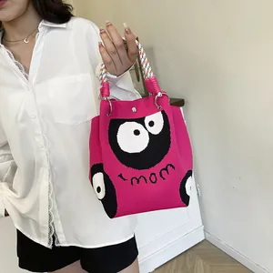 Rose red knitted tote bag featuring cartoon monster and spiral rope handle design