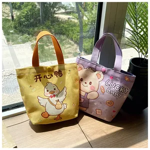 Detail of cute cartoon canvas gift bags with snap button closure and sturdy handles