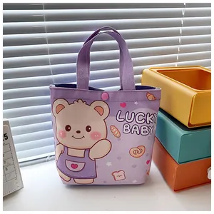 Detail of lavender canvas bag with cute bear print and LUCKY BABY text side view