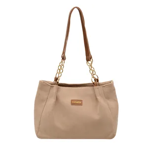 Khaki corduroy tote bag with brown leather straps and gold chain accents for women
