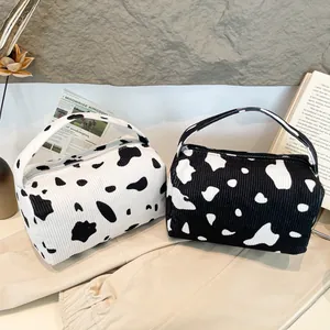 Cow print corduroy handbag set with cylinder shape and minimalist zipper closure