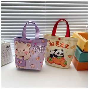 Detail of canvas gift bags showing panda graphics and snap button closures for security