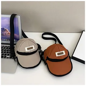 Unique hat-shaped nylon crossbody bags in beige and brown with adjustable shoulder straps