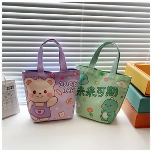 Detail of cute cartoon canvas tote bags with snap closure and lucky bear dinosaur prints