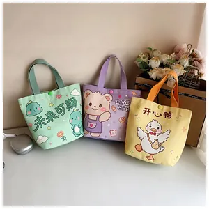 Detail of colorful canvas gift bags with cartoon designs and plastic snap button closure