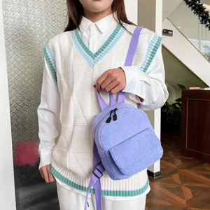 Mini lavender corduroy backpack detail featuring vertical textures and adjustable straps