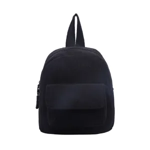 Mini black corduroy backpack with front pocket and vertical texture on white background