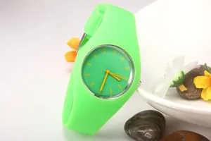 Macro shot of a fluorescent green Geneva silicone watch with contrasting yellow hour markers