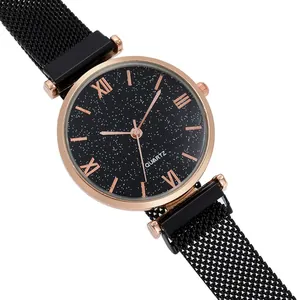 Detail of starry night dial with Roman numerals and black Milanese mesh watch strap
