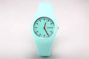 Detail view of mint green Geneva quartz watch with silicone strap and red contrast markers