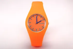 Close-up of vibrant orange Geneva quartz watch with silicone strap and blue dial details