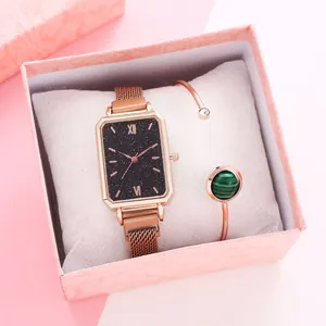 Close-up of square rose gold watch with black dial and matching gemstone bracelet in gift box