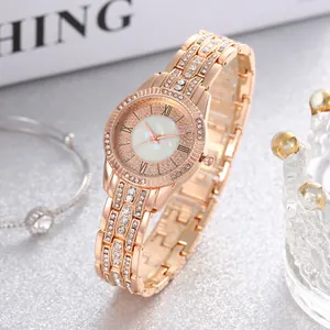 Elegant rose gold women's watch with mother of pearl dial and sparkling rhinestone accents
