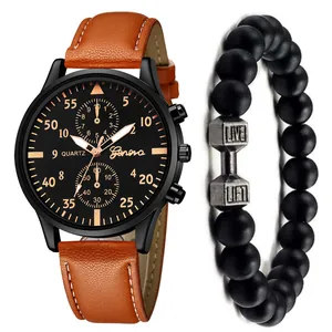 Detail of men's quartz watch with brown leather strap and black beaded dumbbell bracelet