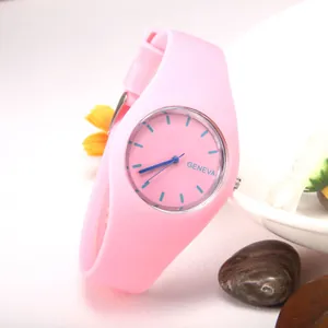 Pink Geneva silicone watch with blue hands on a decorative floral background display