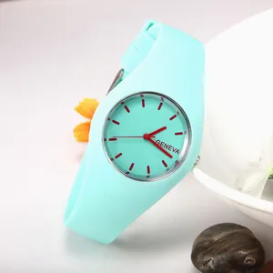Minimalist Geneva quartz watch with mint green silicone strap and red hour markers